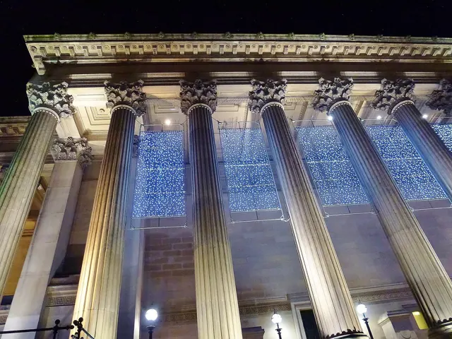 Classical columns uplit at night