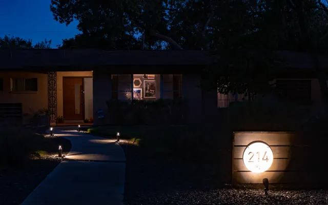 Low-voltage path lights along a front walkway at night